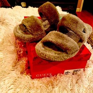 Guess grey faux fur slippers.